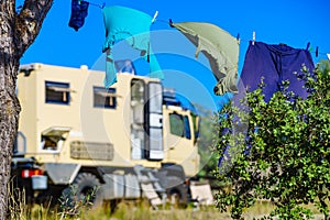 Camping. Clothes hanging to dry by rv lorry motorhome