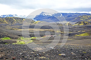 Camping Emstrur against the backdrop of the beautiful landscape of glaciers and the colorful mountains of Iceland. Tourism and