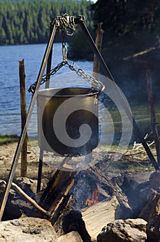 Camping fire on a lake shore