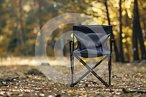Camping folding chair, furniture, against a background of nature