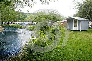 Camping forest meadow in the river shore
