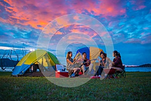 Camping of happy asian young travellers at lake