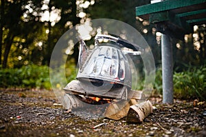 Camping iron kettle. Autumn photo