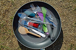 Camping kitchen utensils drying in the sun