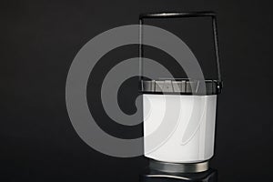 Camping lantern on black background, closeup with space for text. Military training equipment