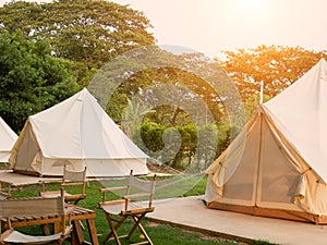 Camping picnic tent campground in outdoor hiking forest. Camper while campsite in nature background at summer trip camp. Adventure