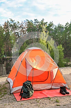 Camping tent and accessories in wilderness