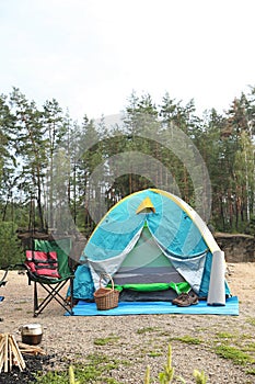 Camping tent and accessories in wilderness