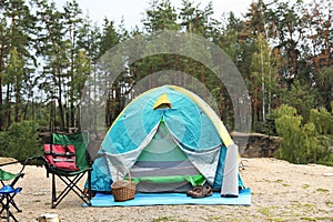 Camping tent and accessories in wilderness