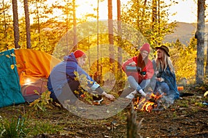 Camping tent camp in nature happy caucasian friends in autumn at nature forest, hike