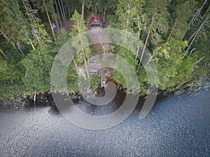 Camping with a tent in the forest in nature near the lake, photo from a drone in the summer