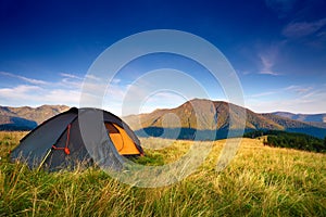 Camping tent on the mountain meadow