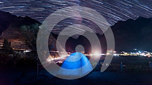 Camping tent under star trails milkyway in himalayas