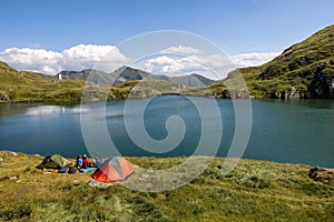 Camping tents on capra lake in fagaras mountains romania