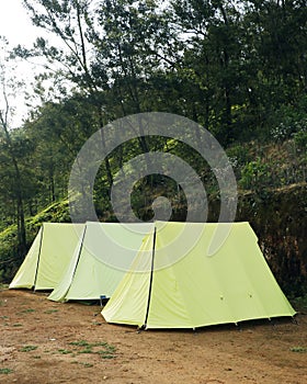 camping tents in mountain valley in kerala india for turists photo