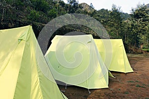 camping tents in mountain valley in kerala india for turists photo