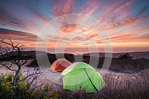 Camping tents overlooking the ocean in California at Sunset