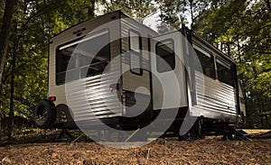 Camping trailer in a nice shady spot