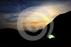 Camping under stars in mountains