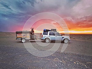 Camping Vehicle in the desert at sunset