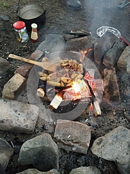 Camplife. Camping. Outdoor. Hiking. Treking. Potatos on the fire photo