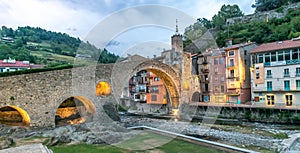 Camprodon, the medieval town and the old bridge in Catalonia Spain, seen at sunset