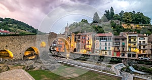 Camprodon, the medieval town and the old bridge in Catalonia Spain, seen at sunset