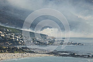 CAMPS BAY, CAPE TOWN, 13 October 2017 - Helicopters fight Camps Bay fire fanned by strong westerly winds.