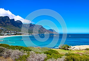 Camp`s Bay Beach and the twelve apostles mountain range in Cape Town, South Africa