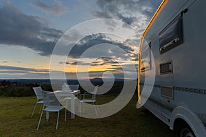 Campsite with caravans at dusk time photo