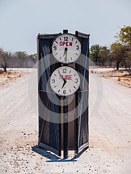 Campsite gate with marked opening and closing time