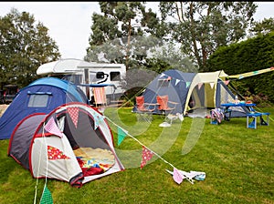 Campsite With Pitched Tents And Campervan photo