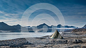 Campsite tents in Svalbard at glacier front tongue