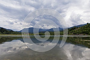 Mountain landscape reflectin in Campul lui Neag lake