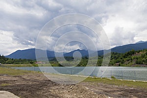 Mountain landscape reflectin in Campul lui Neag lake photo