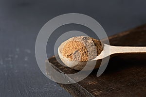 Camu-camu powder in a wooden spoon photo