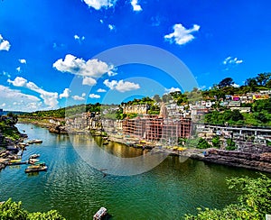 Ultra Wide image of Omkareshwar Jyotirlinga a shiv temple on Omkar mountain an island in Narmada, Madhyapradesh, India photo