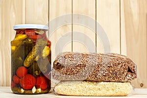 Can of canned cucumbers, tomatoes, squash, bags of rice and buckwheat