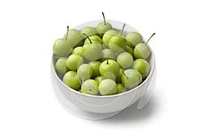 Can Erik plums in a bowl photo
