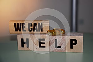 We can help - phrase on wooden blocks with letters, mutual assistance companionship concept