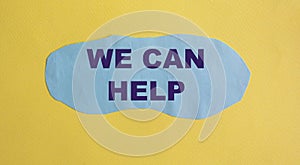 We can help you. Text on blue piece of paper