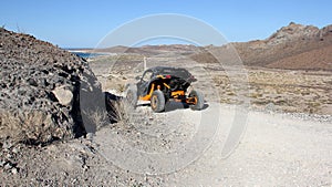 Can-Am Maverick all-terrain vehicle ATV driving down an unpaved mountain road, La Paz, BCS, Mexico