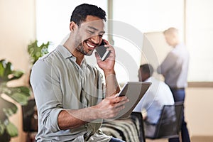 We can meet whenever you have time. a young businessman using his smartphone to make a phone call while holding his