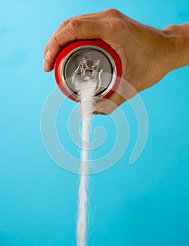 Can pouring sugar stream in calories content of soda energetic and refreshing drinks