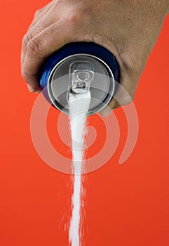 Can pouring sugar stream in calories content of soda energetic and refreshing drinks