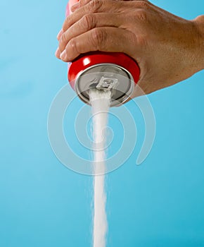 Can pouring sugar stream in calories content of soda energetic and refreshing drinks