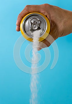 Can pouring sugar stream in calories content of soda energetic and refreshing drinks