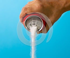 Can pouring sugar stream in calories content of soda energetic and refreshing drinks