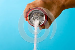 Can pouring sugar stream in calories content of soda energetic and refreshing drinks