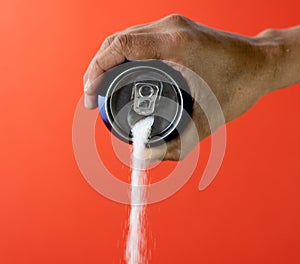 Can pouring sugar stream in calories content of soda energetic and refreshing drinks